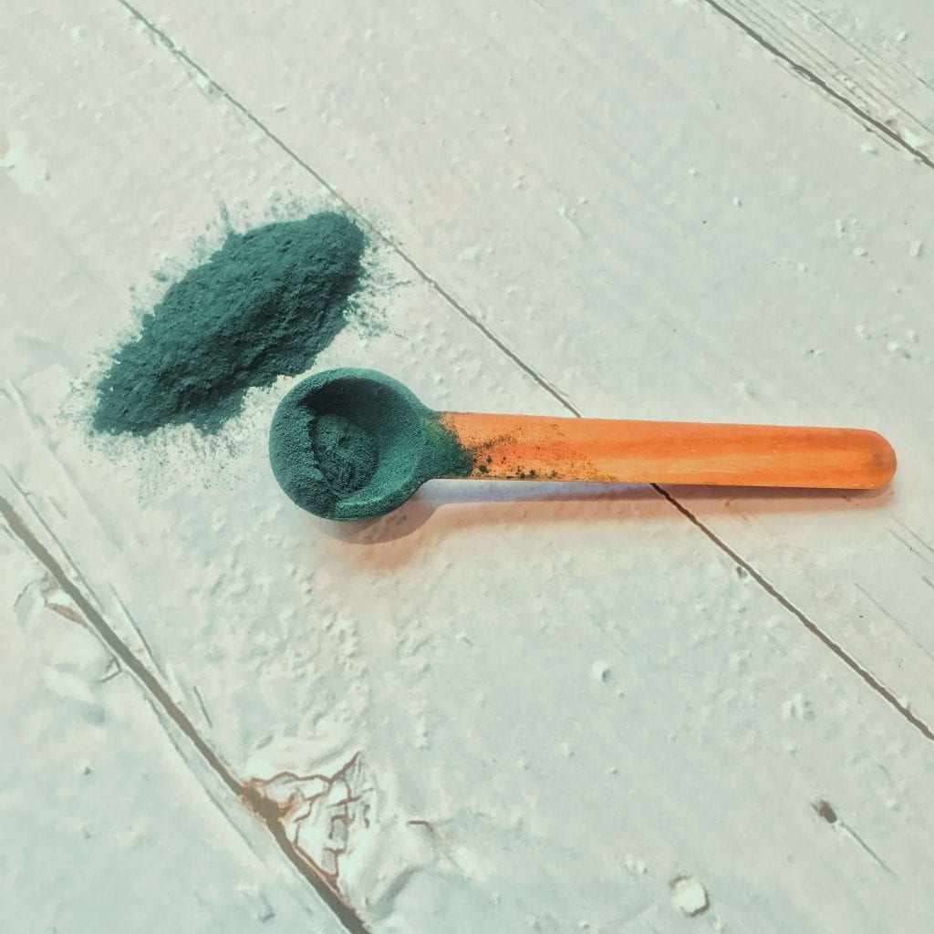 spirulina powder on spoon