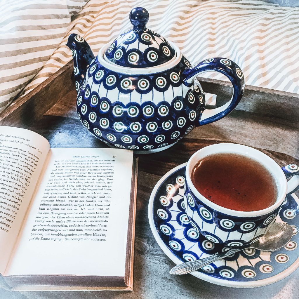 tea pot and cup with book