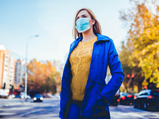 woman in a mask in the city