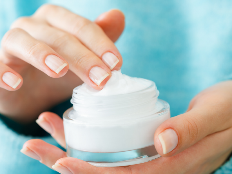 woman pondering the difference between hydrating and moisturizing