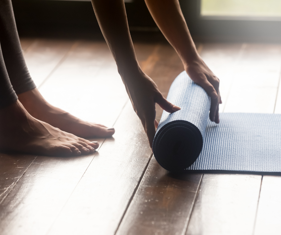 rolling up a yoga mat